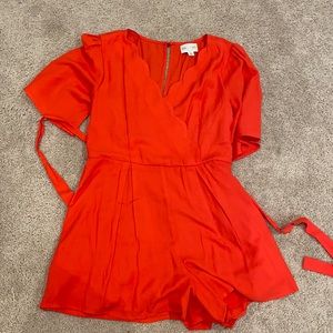 Red Francesca’s Romper w/ front tie